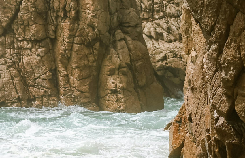 Waves against a cliff face