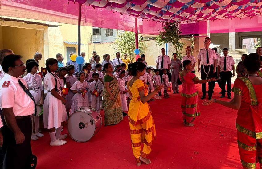 Commissioners Hill are welcomed by a crowd, music and dancers