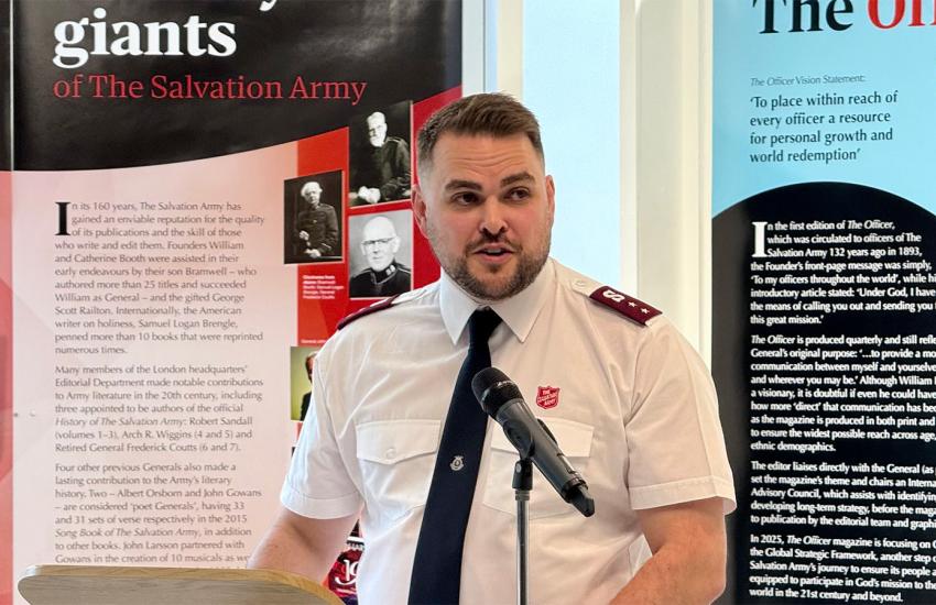 Captain John Clifton speaks in front of the literary exhibition