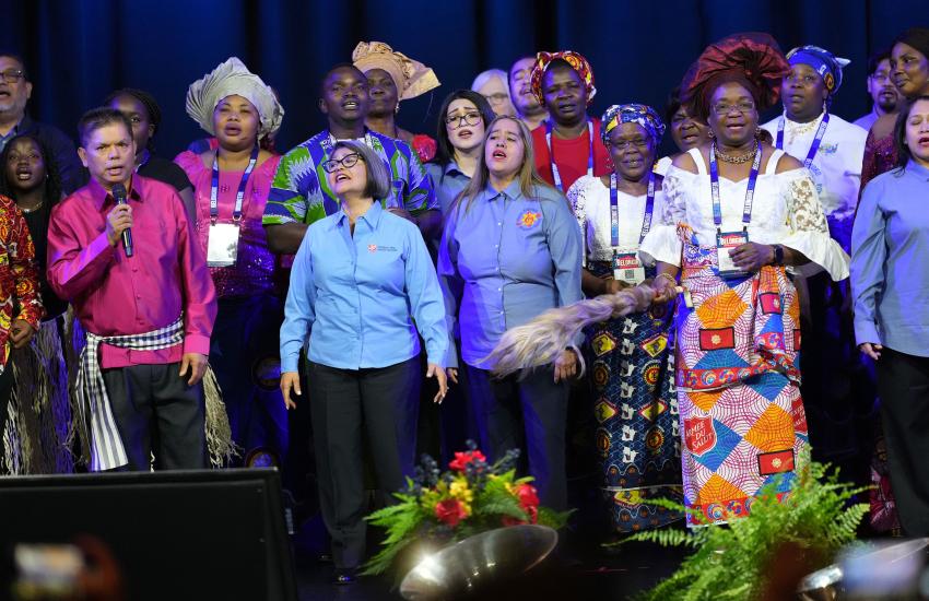 A choir sings on stage