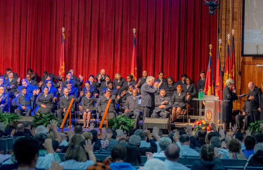 USA Southern Territorial Secretaries along with cadets and Bible Conference delegates, pray a blessing over the international leaders