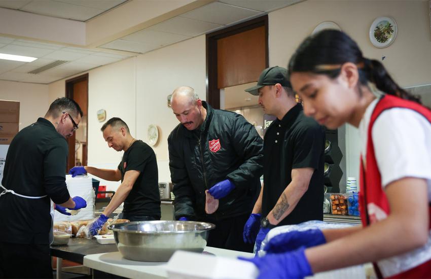 Salvation Army volunteers prepare sandwiches