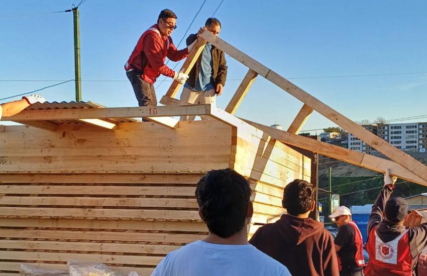 Salvation Army team members unload building materials