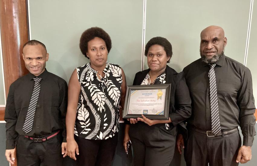 Church Partnership Program team members hold the award