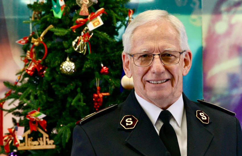 General Brian Peddle stands in front of a Christmas tree
