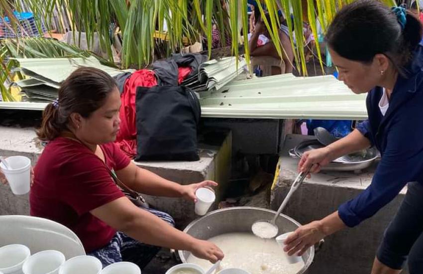 A Salvation Army volunteer serves food