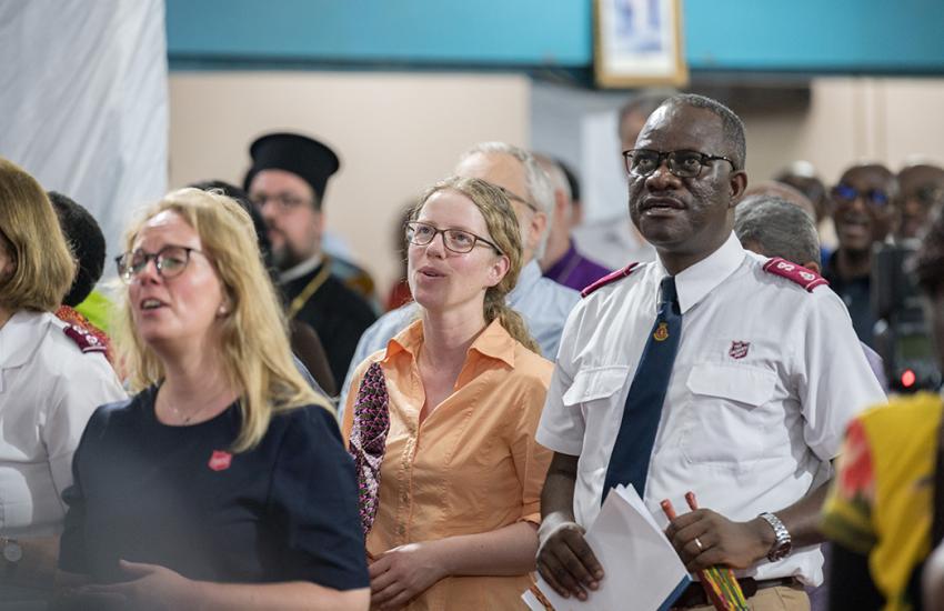 People sing in worship