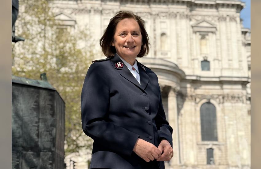 Comissioner Jane Paone stands in front of St Paul's Cathedral on a sunny day. She wears her Salvation Army uniform.