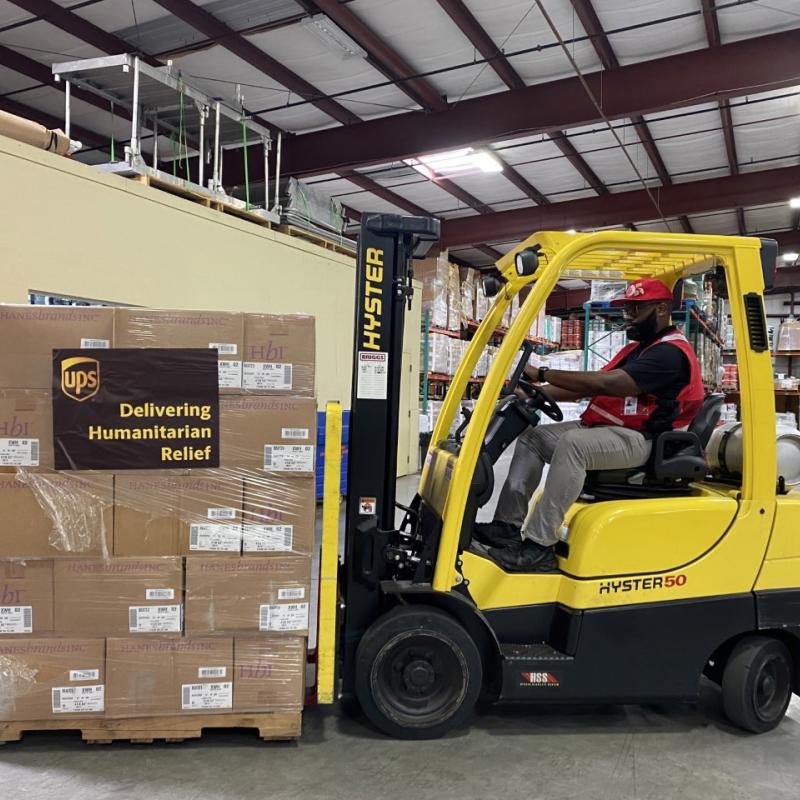 Fork-lift truck loading Salvation Army emergency supplies