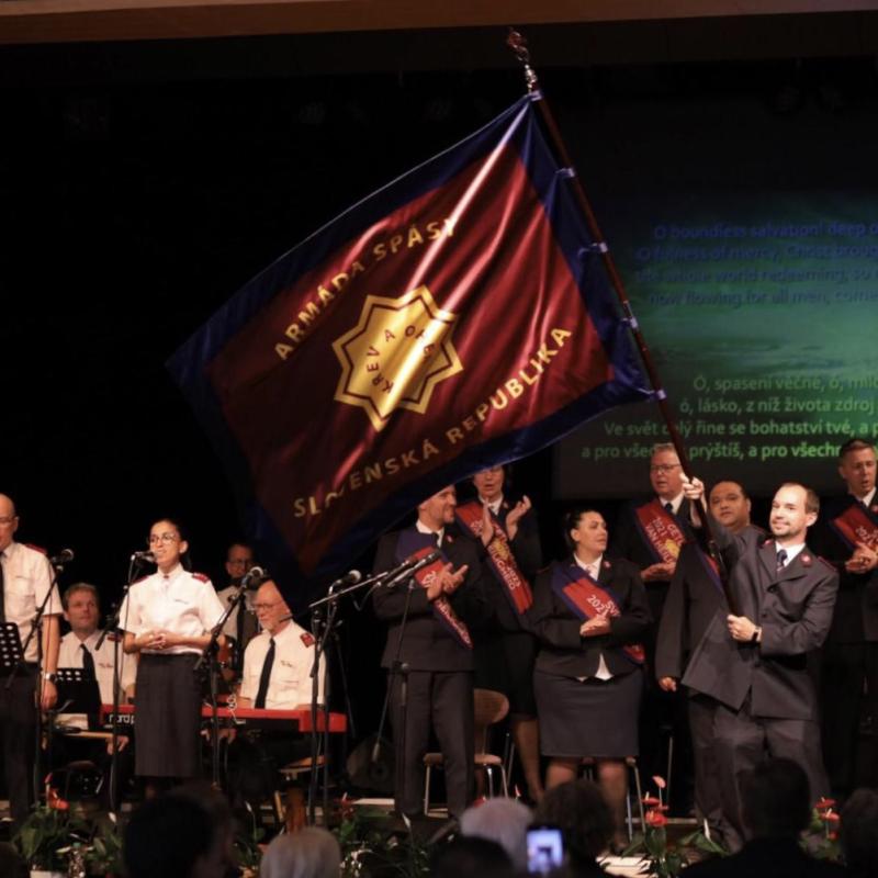 A Salvationist waves the Slovakian Salvation Army flag