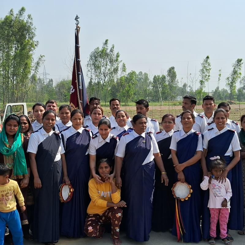 A large group, some wearing Salvation Army uniform