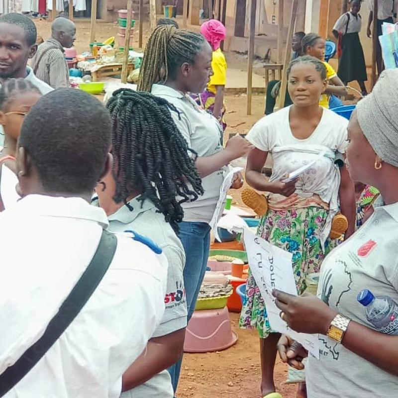 Women in Salvation Army t-shirts speak to people on the street