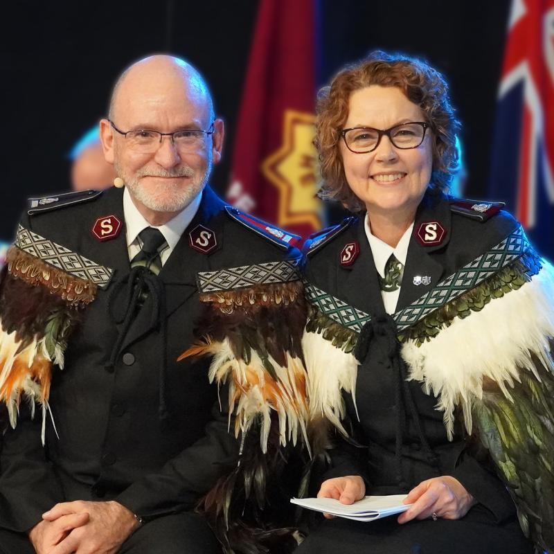 General Lyndon Buckingham and Commissioner Bronwyn Buckingham in full Salvation Army uniform and feathered Korowai (Māori cloak)