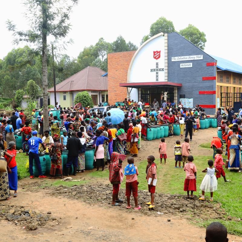 A crowd of people outside a Salvation Army hall