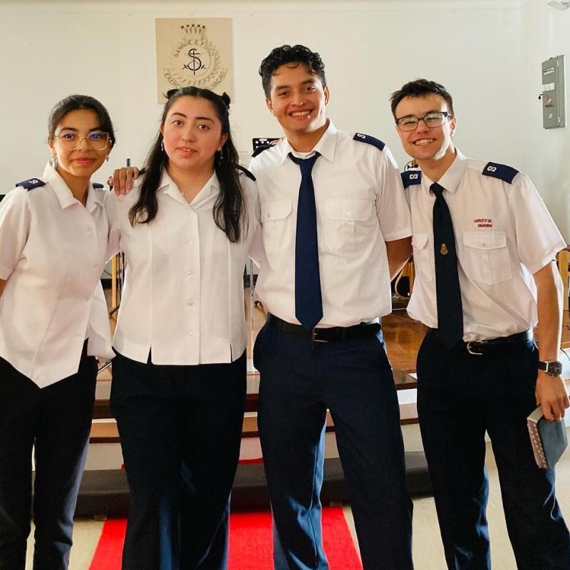 Four people in Salvation Army uniform