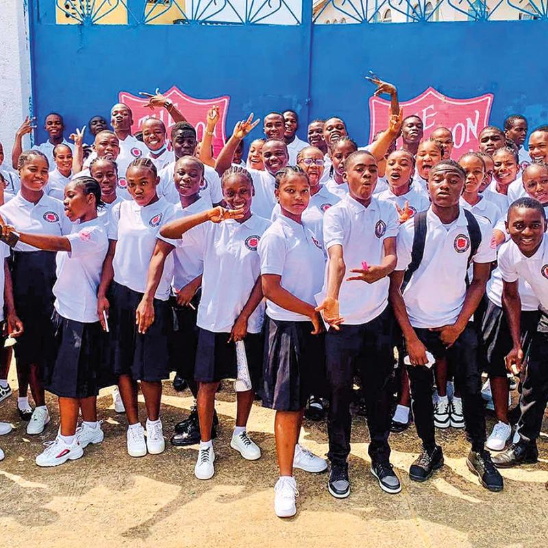 A large group of students pose for the camera