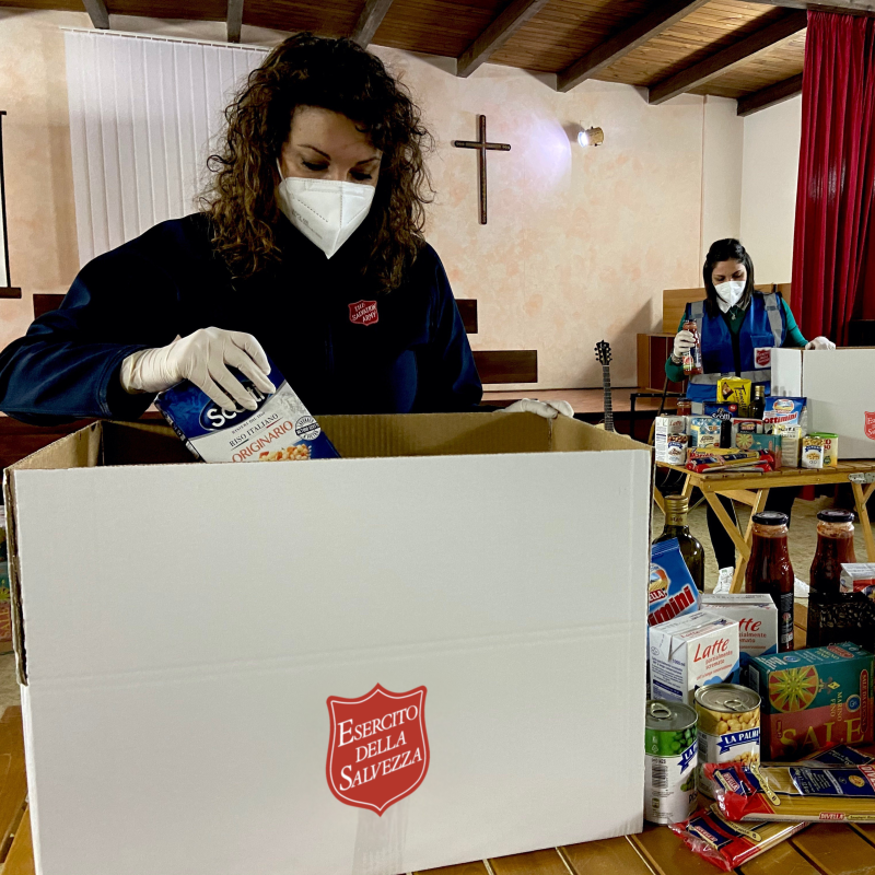 Volunteers pack food parcels