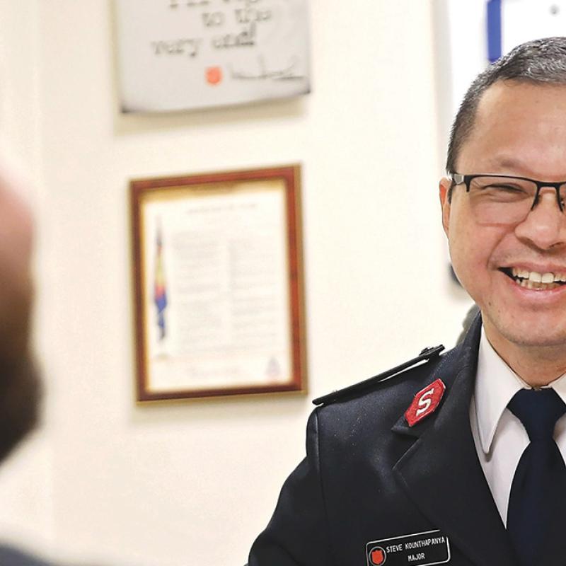 A Salvation Army officer in conversation with someone
