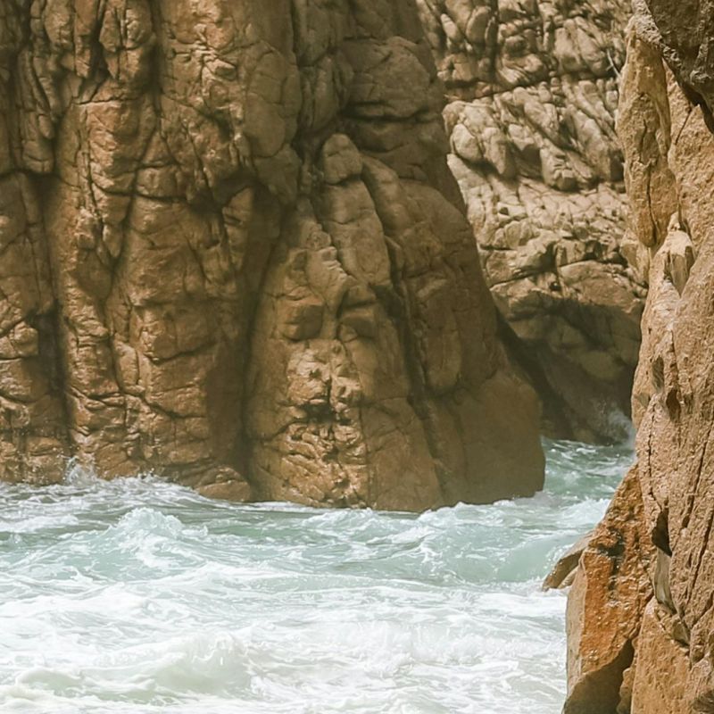 Waves against a cliff face