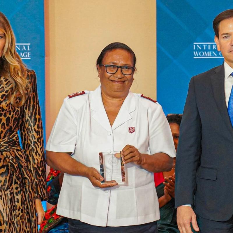 Major Velena Iga (centre) with her award, alongside Melania Trump and Marco Rubio