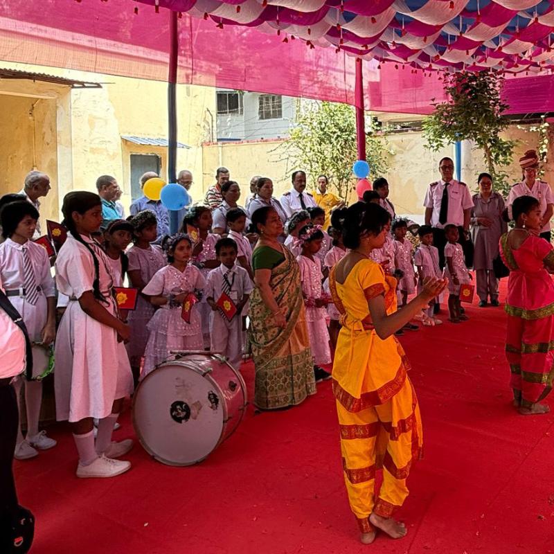 Commissioners Hill are welcomed by a crowd, music and dancers