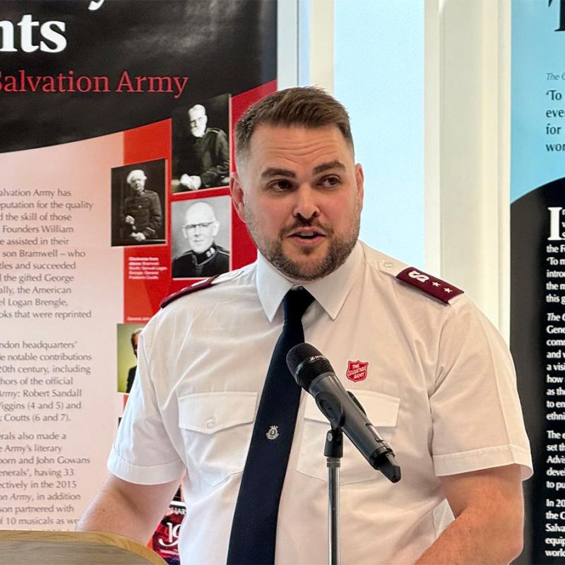 Captain John Clifton speaks in front of the literary exhibition