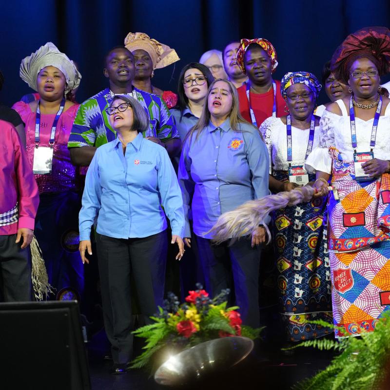 A choir sings on stage