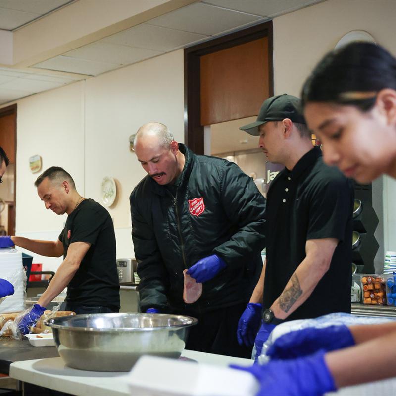 Salvation Army volunteers prepare sandwiches
