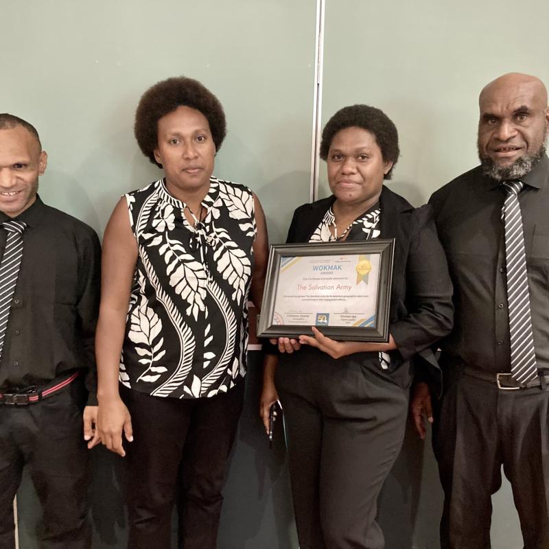 Church Partnership Program team members hold the award