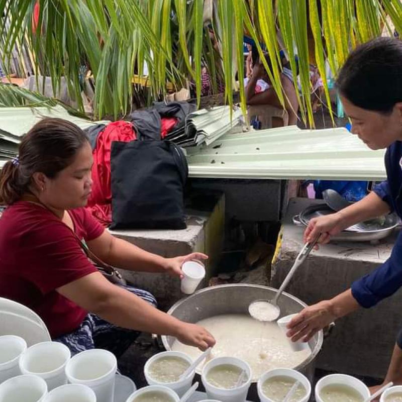 A Salvation Army volunteer serves food