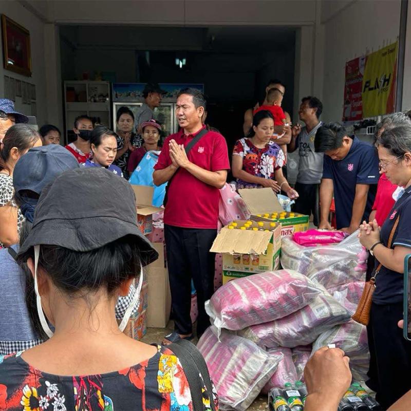 A Salvation Army team member prays over supplies
