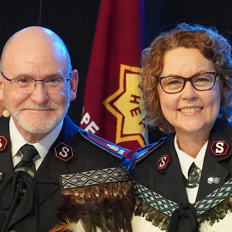 General Lyndon Buckingham and Commissioner Bronwyn Buckingham in full Salvation Army uniform and feathered Korowai (Māori cloak)