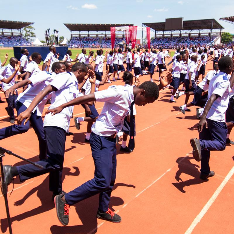 Young people dance in the stadium