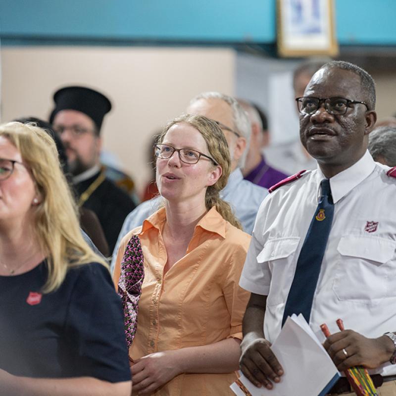 People sing in worship