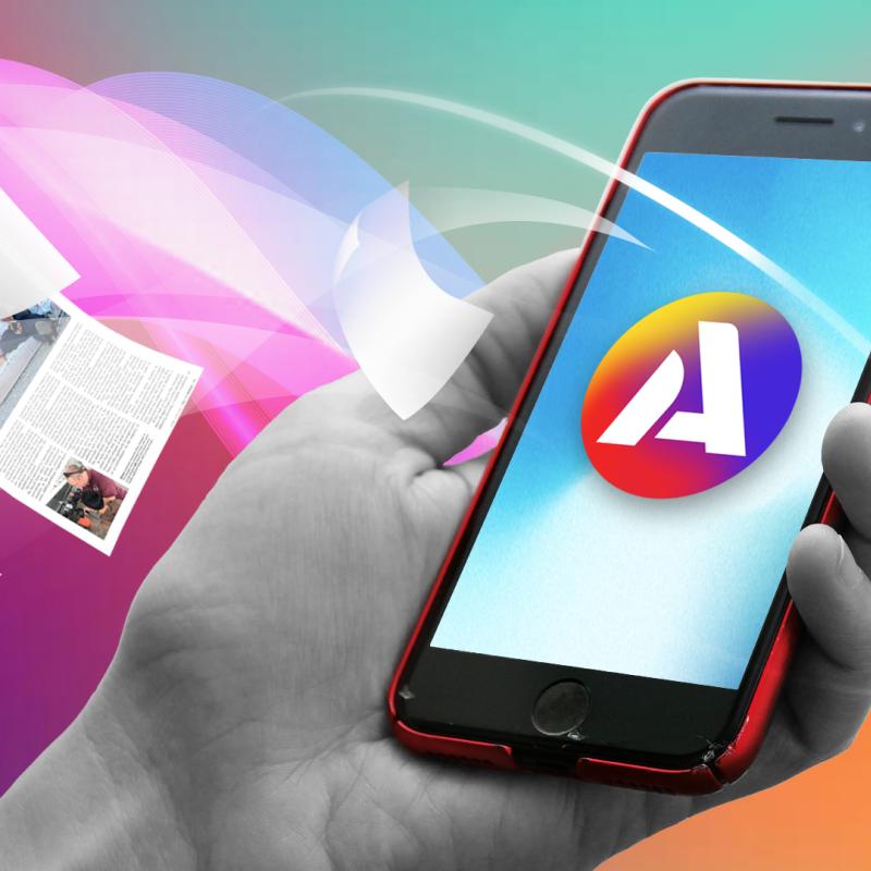 Lose pages of All the World printed magazine merge into a smart phone demonstrating the move from print to online